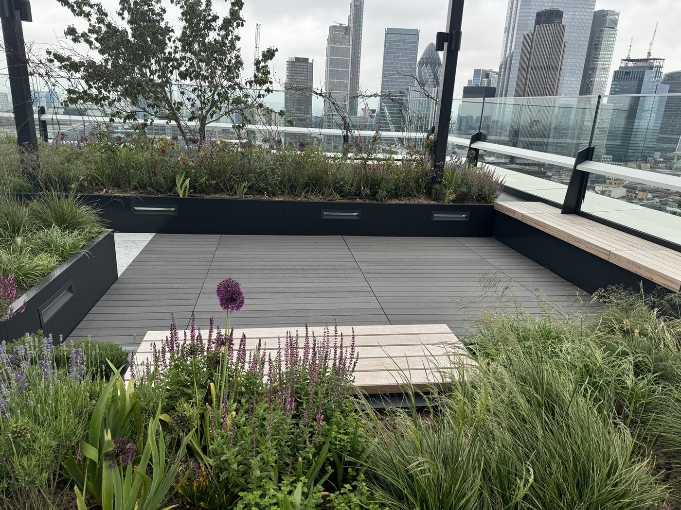 Landscaped rooftop terrace with London skyline